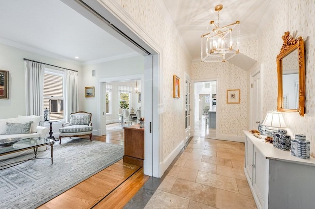 hallway with a chandelier and ornamental molding