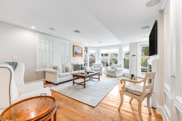 living room with light hardwood / wood-style floors