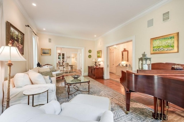 living room featuring light hardwood / wood-style flooring and crown molding