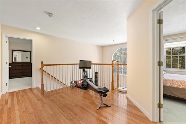 workout area with wood-type flooring