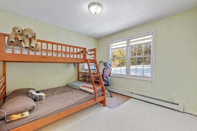 carpeted bedroom with a baseboard radiator