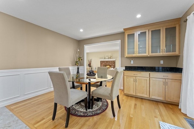 dining space featuring a wainscoted wall, recessed lighting, light wood-style flooring, and visible vents