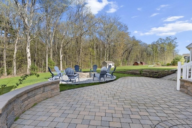 view of patio with an outdoor fire pit
