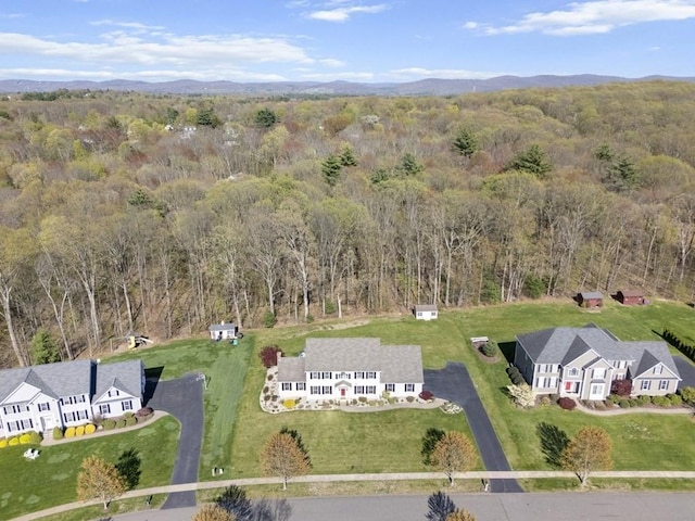drone / aerial view with a view of trees