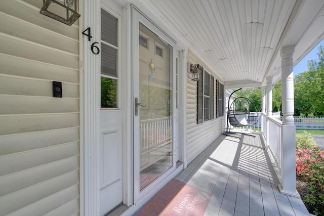 wooden deck featuring covered porch