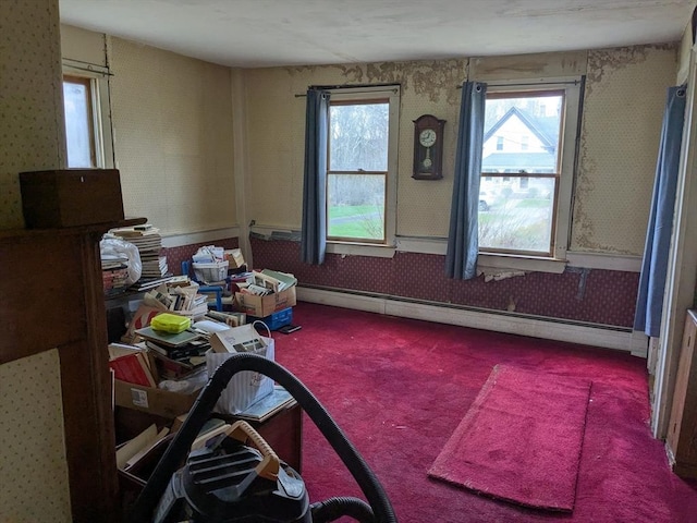 miscellaneous room featuring carpet floors, baseboard heating, and wallpapered walls