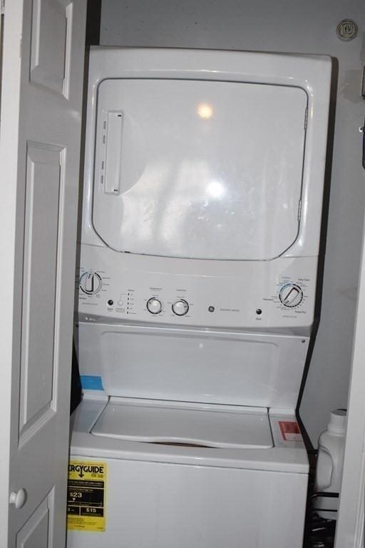 laundry area featuring laundry area and stacked washing maching and dryer