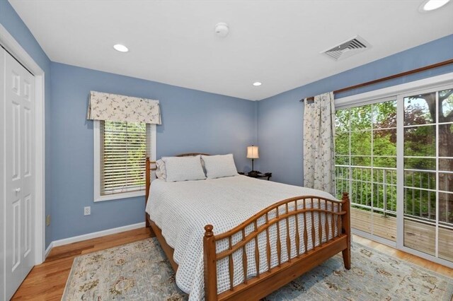 7 Conant Rd Unit 37, Winchester, MA 01890 - bedroom with multiple windows, wood finished floors, baseboards, access to outside, and recessed lighting