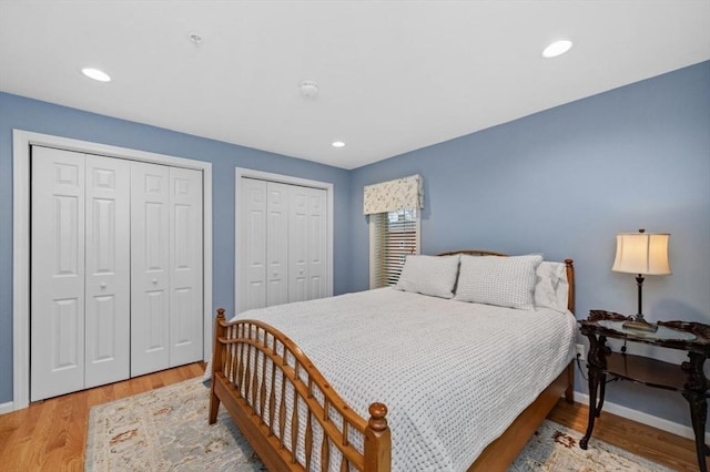 7 Conant Rd Unit 37, Winchester, MA 01890 - bedroom with two closets, baseboards, light wood-type flooring, and recessed lighting