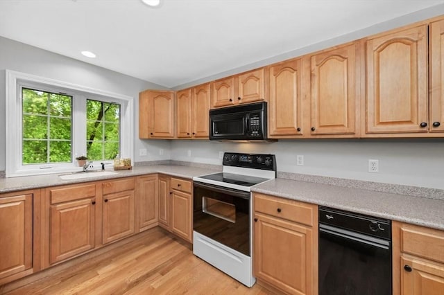 7 Conant Rd Unit 37, Winchester, MA 01890 - kitchen featuring black microwave, electric stove, light wood finished floors, a sink, and light countertops