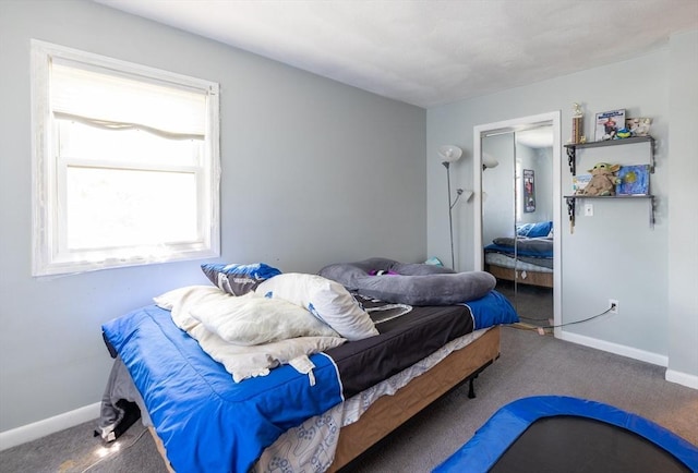 27 Harrison St Unit C, Boston, MA 02131 - carpeted bedroom with baseboards and a closet
