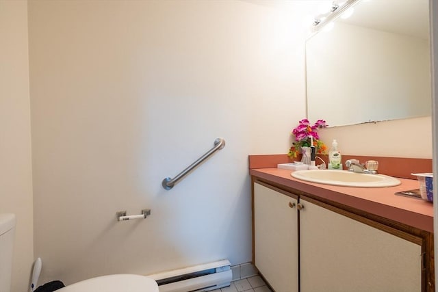 27 Harrison St Unit C, Boston, MA 02131 - bathroom with baseboard heating, vanity, and tile patterned floors