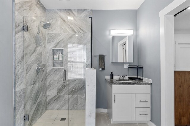 bathroom with an enclosed shower and vanity