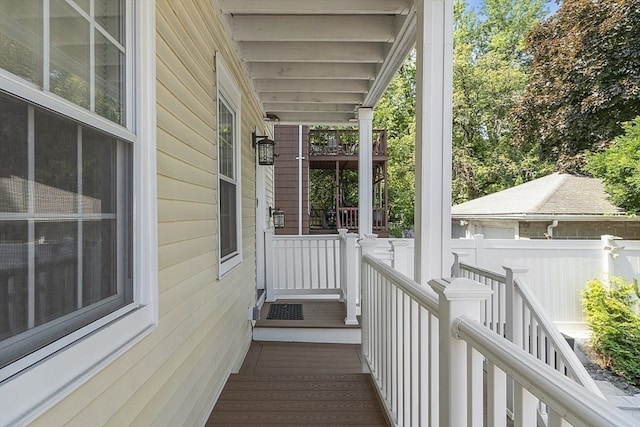 wooden terrace with a porch