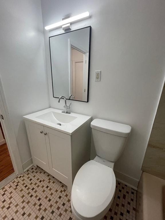766 Willard St Unit A7, Quincy, MA 02169 - bathroom with vanity, toilet, and baseboards