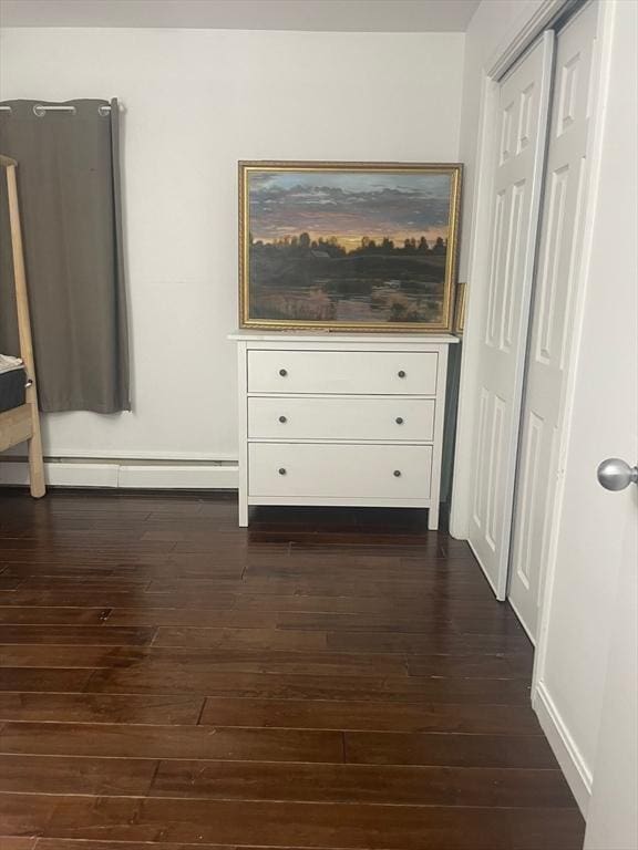 766 Willard St Unit A7, Quincy, MA 02169 - bedroom with baseboard heating, dark wood-type flooring, and baseboards