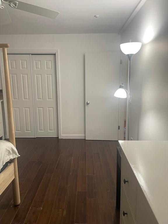 766 Willard St Unit A7, Quincy, MA 02169 - unfurnished bedroom with dark wood finished floors, a closet, a ceiling fan, and baseboards
