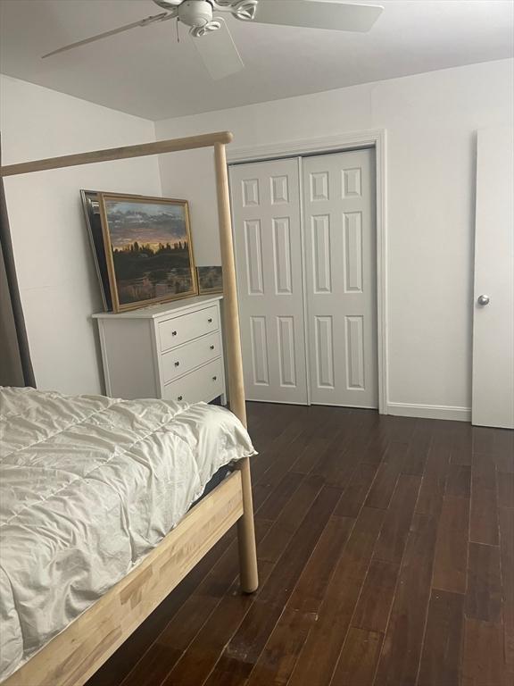 766 Willard St Unit A7, Quincy, MA 02169 - bedroom with dark wood-style flooring, a closet, a ceiling fan, and baseboards