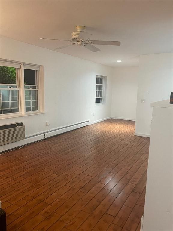 766 Willard St Unit A7, Quincy, MA 02169 - unfurnished room with a ceiling fan, wood finished floors, baseboards, and a baseboard radiator