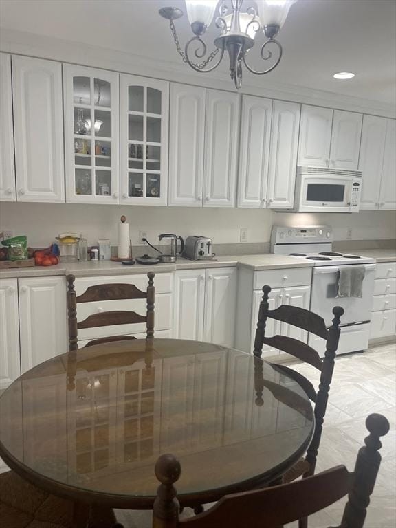 766 Willard St Unit A7, Quincy, MA 02169 - kitchen featuring white appliances, white cabinetry, light countertops, and recessed lighting