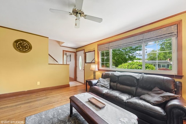 157 Hall St, Mansfield, MA 02048 - living room with wood finished floors, healthy amount of natural light, a ceiling fan, and stairs