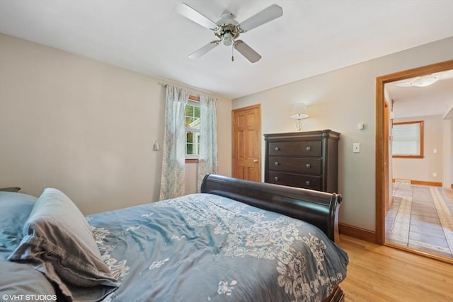 157 Hall St, Mansfield, MA 02048 - bedroom with light wood finished floors, baseboards, and ceiling fan