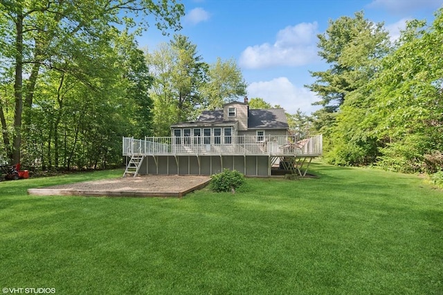 157 Hall St, Mansfield, MA 02048 - back of property featuring a deck, stairs, a yard, and a chimney