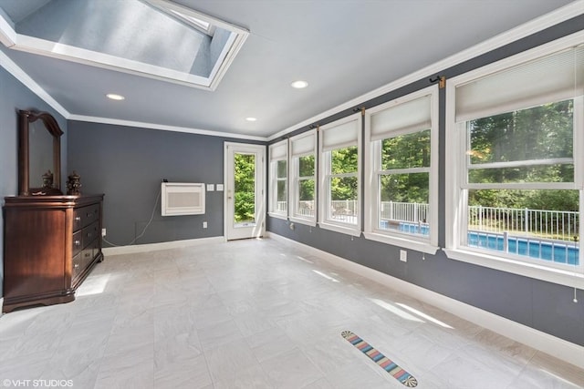 157 Hall St, Mansfield, MA 02048 - unfurnished living room featuring crown molding, a skylight, baseboards, and recessed lighting
