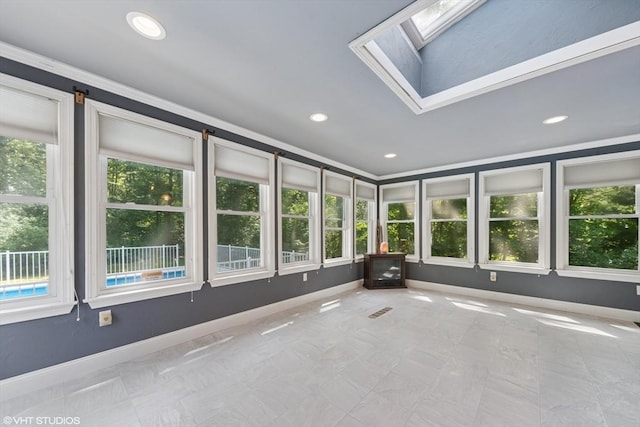157 Hall St, Mansfield, MA 02048 - unfurnished sunroom featuring plenty of natural light, a skylight, baseboards, and recessed lighting