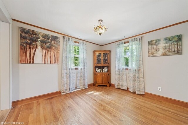 157 Hall St, Mansfield, MA 02048 - empty room with wood finished floors, crown molding, and baseboards