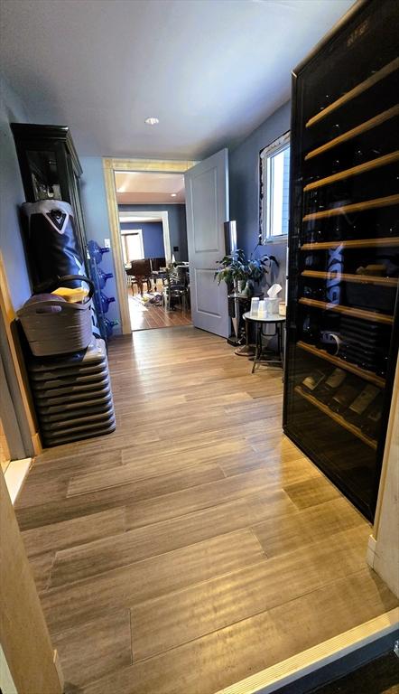 corridor featuring hardwood / wood-style flooring