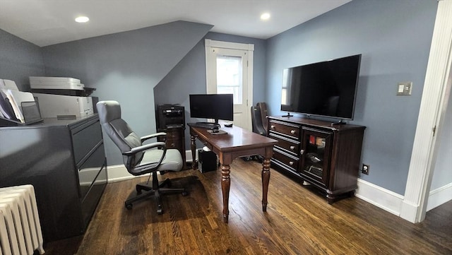 office featuring radiator, vaulted ceiling, and dark wood-type flooring