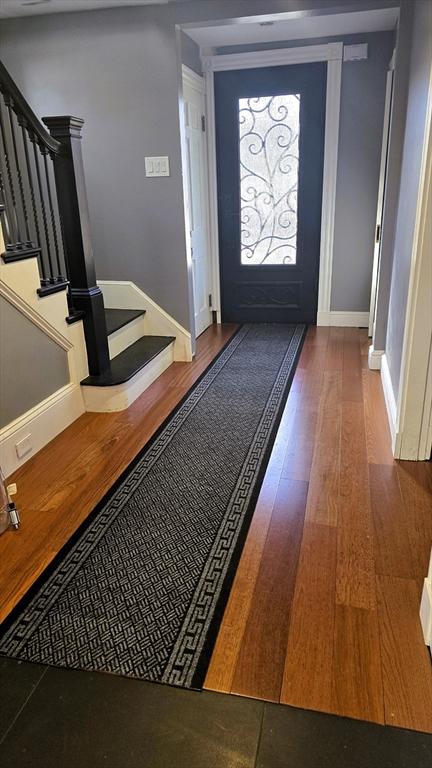 foyer entrance with hardwood / wood-style floors