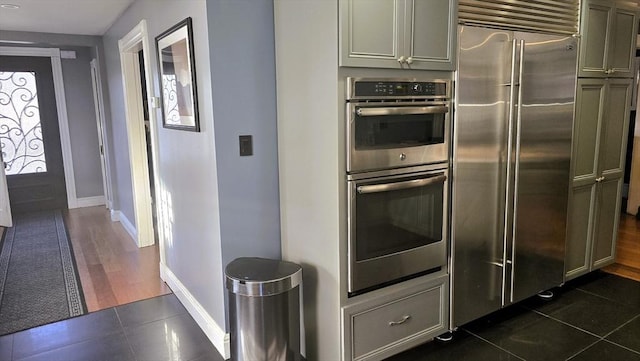 kitchen with stainless steel appliances and gray cabinets