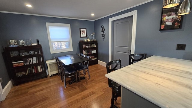 interior space featuring radiator heating unit, ornamental molding, and dark wood-type flooring