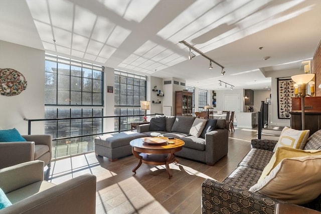 living room featuring floor to ceiling windows