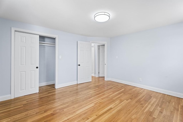 69 Kingman Ave, Revere, MA 02151 - unfurnished bedroom with light wood-style flooring and a closet