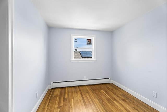 69 Kingman Ave, Revere, MA 02151 - unfurnished room featuring a baseboard radiator and wood finished floors