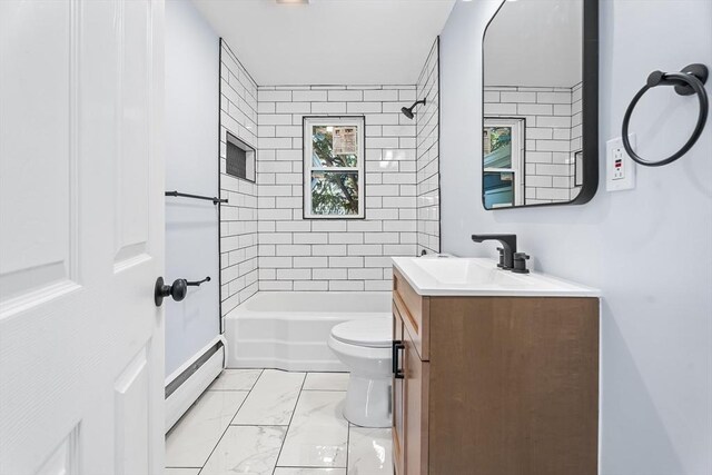 69 Kingman Ave, Revere, MA 02151 - full bathroom with a baseboard radiator, vanity, shower / tub combination, and marble look tile flooring