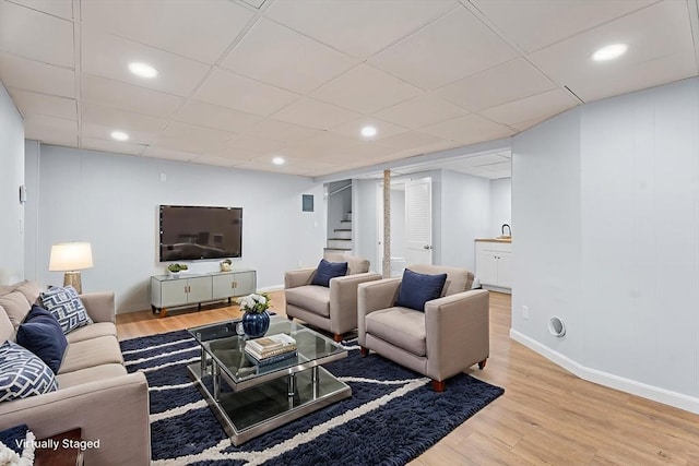 69 Kingman Ave, Revere, MA 02151 - living room with wood finished floors, stairway, recessed lighting, and a paneled ceiling