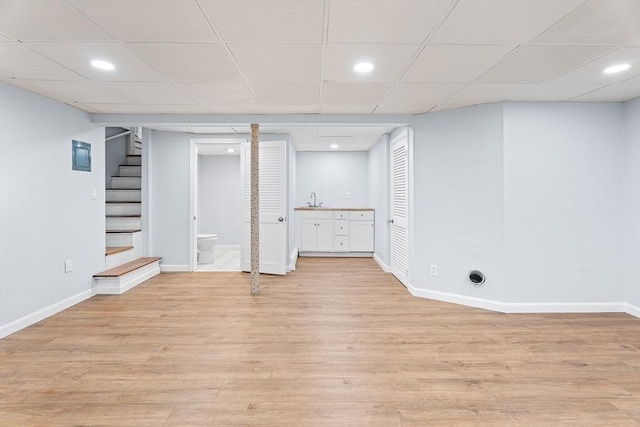 69 Kingman Ave, Revere, MA 02151 - finished below grade area with stairway, light wood finished floors, a drop ceiling, and recessed lighting