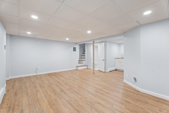 69 Kingman Ave, Revere, MA 02151 - finished below grade area featuring light wood-style flooring, stairs, recessed lighting, and a paneled ceiling