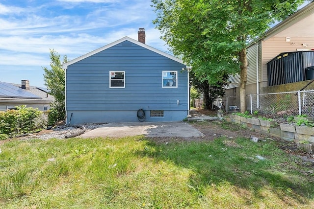 69 Kingman Ave, Revere, MA 02151 - rear view of property with a patio area and a chimney