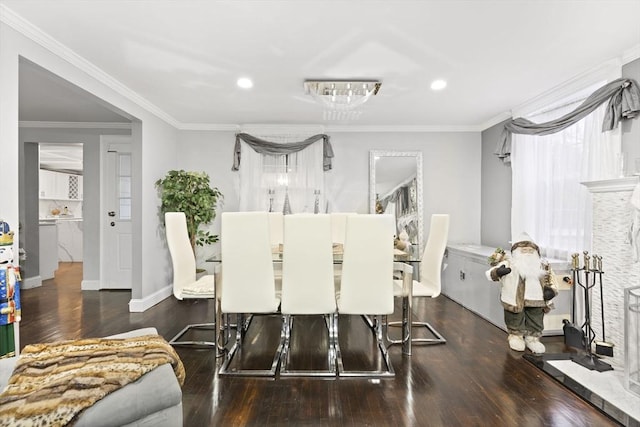 dining area with crown molding and dark hardwood / wood-style flooring