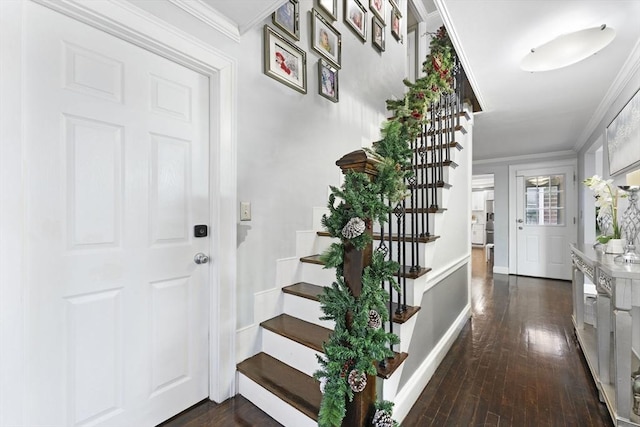 entrance foyer with dark hardwood / wood-style flooring and ornamental molding