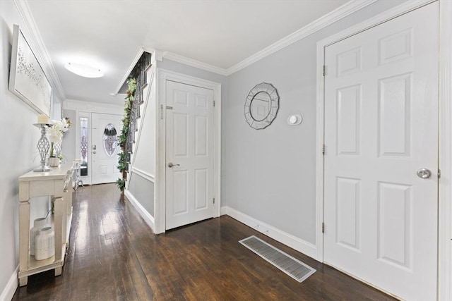 entrance foyer featuring dark hardwood / wood-style flooring and ornamental molding