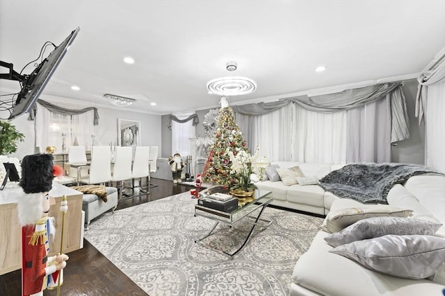 living room featuring dark hardwood / wood-style floors and ornamental molding