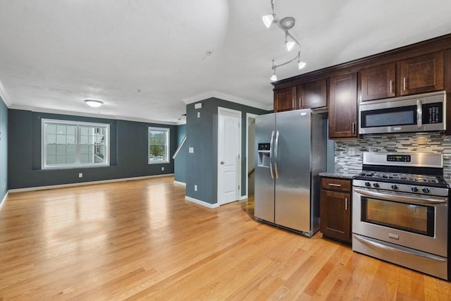 kitchen featuring stainless steel appliances, crown molding, dark brown cabinets, light wood-style floors, and backsplash