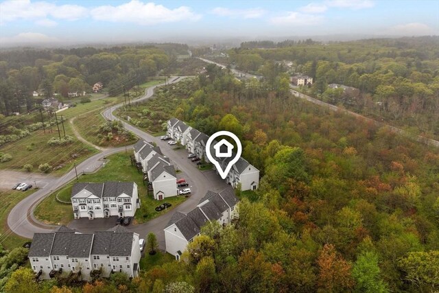 drone / aerial view of a heavily wooded area