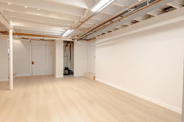 99 Oak St, North Attleboro, MA 02760 - finished below grade area featuring light wood-style floors and baseboards